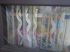 Broken window in child's room that was fitted with SafeVision clear safety film